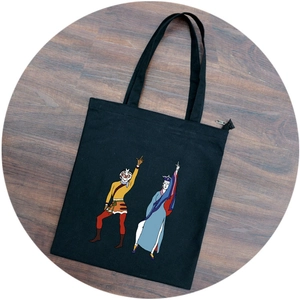 Black canvas tote bag featuring Sun Wukong cartoon print and zipper closure