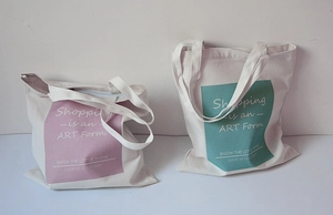 Minimalist canvas tote bag with artistic typography print in pink and green colors