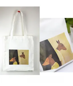 Detail of cartoon deer print on durable white cotton canvas tote bag with reinforced handles
