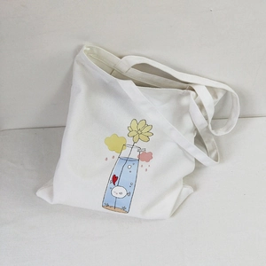 Detail of white canvas tote bag featuring colorful cartoon floral and vase illustration