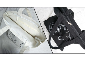 Détail du sac en toile avec fermeture éclair supérieure et pochette de rangement interne