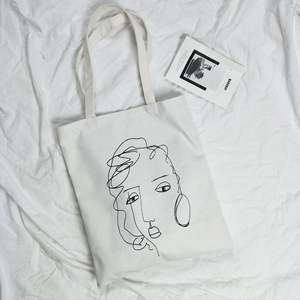 Sac fourre-tout en toile blanche avec illustration de visage en lignes abstraites