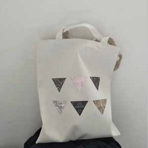 Minimalist canvas tote bag with marble triangle patterns and sturdy shoulder straps