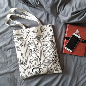 Detail of durable white canvas tote bag featuring black line art manga illustration