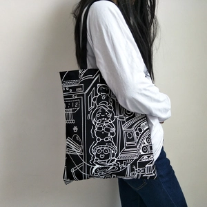 Minimalist canvas tote bag with black cartoon illustration and large capacity for women