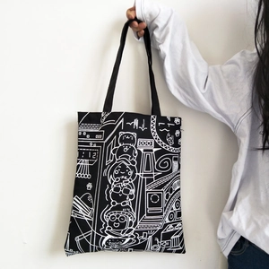 Japanese style black canvas tote bag featuring white cartoon character illustrations for women