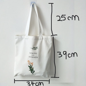 Detailed size chart showing 39cm height and 34cm width of this white canvas tote bag