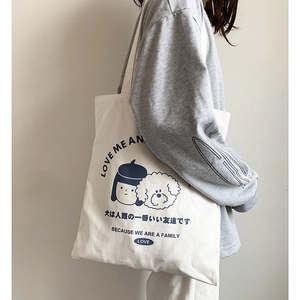 Sac fourre-tout minimaliste en toile crème avec imprimé dessin animé pour un usage quotidien
