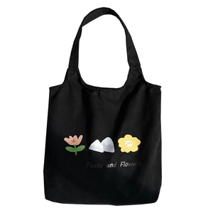 Minimalist black canvas tote bag with Peaks and Flowers graphic print for women