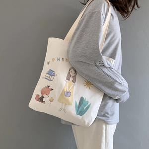 Close-up of white canvas tote bag with cute cartoon girl illustration and milk text