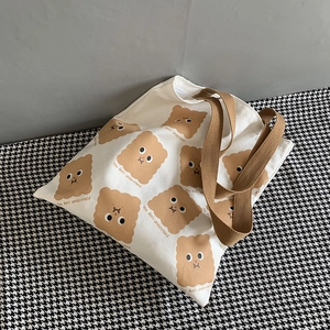Sac cabas mignon en toile beige avec motifs de biscuits et anses marron