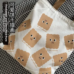 Gros plan sur la toile de coton épaisse et l'imprimé biscuit sur le sac fourre-tout