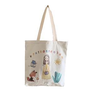 Detail of canvas tote bag featuring cute cartoon girl and fox illustrations