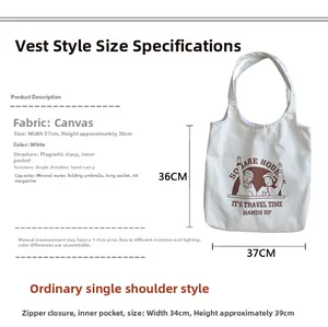 Detail of white canvas tote bag with cartoon print and interior pocket structure