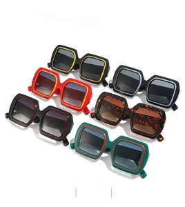 Collection of oversized square sunglasses in various colors with thick frames and dark lenses