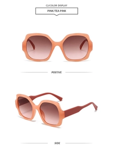 Macro detail of pink square oversized sunglasses with gradient tea lenses and wave frame