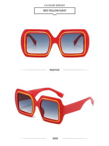 Detail view of retro square red and yellow frame sunglasses with blue gradient lenses