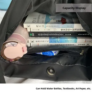 Internal view of a large nylon tote bag showing its spacious capacity for books and water bottle