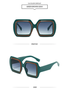 Detail view of square green sunglasses with orange inner frame and gradient lenses