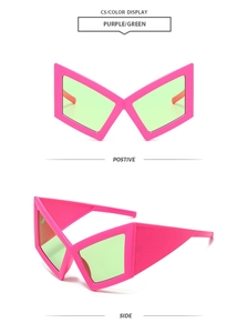 Detail view of purple geometric butterfly sunglasses with light green lenses for party