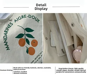 Détail du sac cabas en toile avec imprimé orange, bouton pression et poche zippée interne