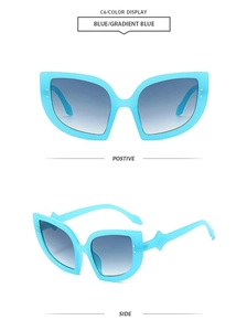 Cat eye sunglasses featuring bright blue frames and gradient lenses from two angles