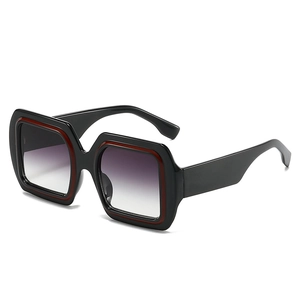 Classic oversized square sunglasses with black frames, red accents and gradient lenses