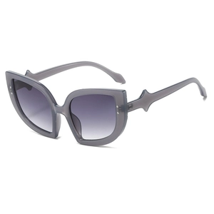 Cat eye sunglasses with translucent grey frames and gradient purple lenses for parties