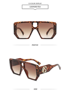 Detail view of leopard print square sunglasses with golden logo on temples