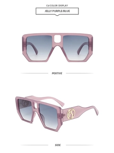Detail view of square jelly purple frames with blue gradient lenses and gold logo