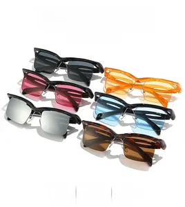 Flat lay of stylish half-frame sunglasses in various colors on a white background
