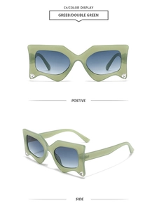 Detail of wavy green frame sunglasses with rhinestones and blue gradient lenses
