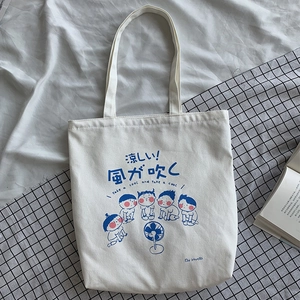 Detail of canvas tote bag with Japanese illustration of characters and electric fan