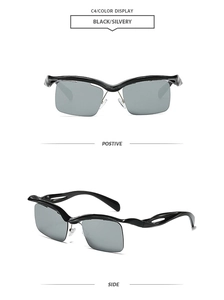 Detail view of futuristic irregular semi-rimless sunglasses in black and silver