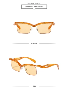 Detail view of orange half-frame sunglasses with streamlined hollow temple design