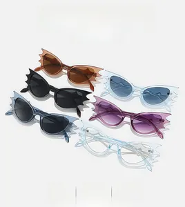 Flat lay of six colorful bat-wing sunglasses showcasing stylish frame color options