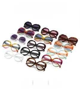 Detailed overhead view of oval frame sunglasses in multiple colors and vintage patterns