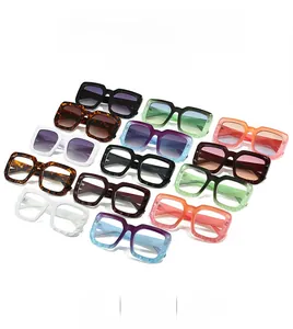 Collection of retro rectangular oversized sunglasses in various stylish colors on white