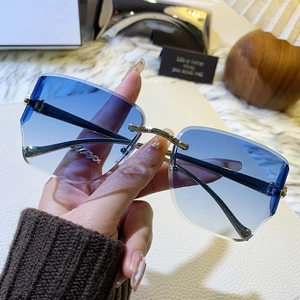 Lunettes de soleil sans monture à verres dégradés bleus et détails de tête de léopard