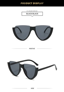 Close-up of black shield sunglasses with geometric frames showing front and side views