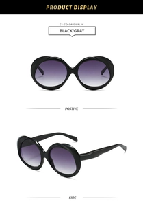 Front and side views of stylish oval black sunglasses with purple gradient lenses