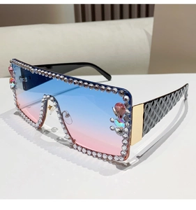 Close-up of oversized gradient lenses with sparkling rhinestones and quilted temples