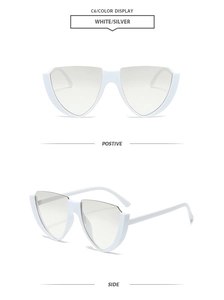 Detail view of avant-garde white shield frame sunglasses with silver flat lenses