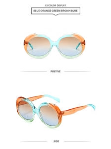 Detail view of oval gradient sunglasses with blue orange green frame and brown lenses