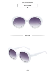 Front and side views of oval white sunglasses with purple gradient lenses