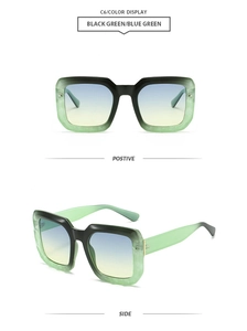 Detail view of large rectangular sunglasses with green marble frames and gradient blue lenses