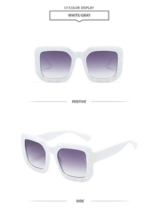 Detail of white rectangular sunglasses featuring purple gradient lenses and modern frame