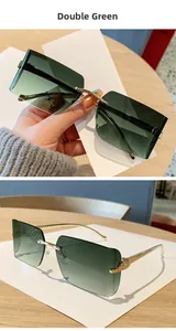 Detail of rimless square sunglasses with gradient green lenses and golden metal temples