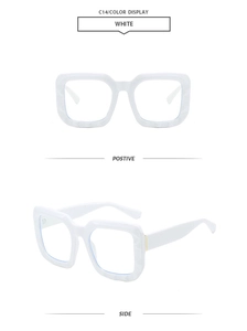 Detail view of white oversized rectangular sunglasses with thick frames and geometric cut