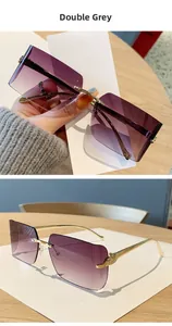 Detail of rimless square sunglasses with gradient grey lenses and golden leopard metal arms